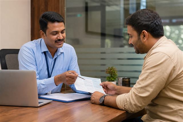 Customer reviewing RC details for insurance and finance